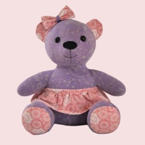 Handmade memory bear sewn from baby clothes — front view