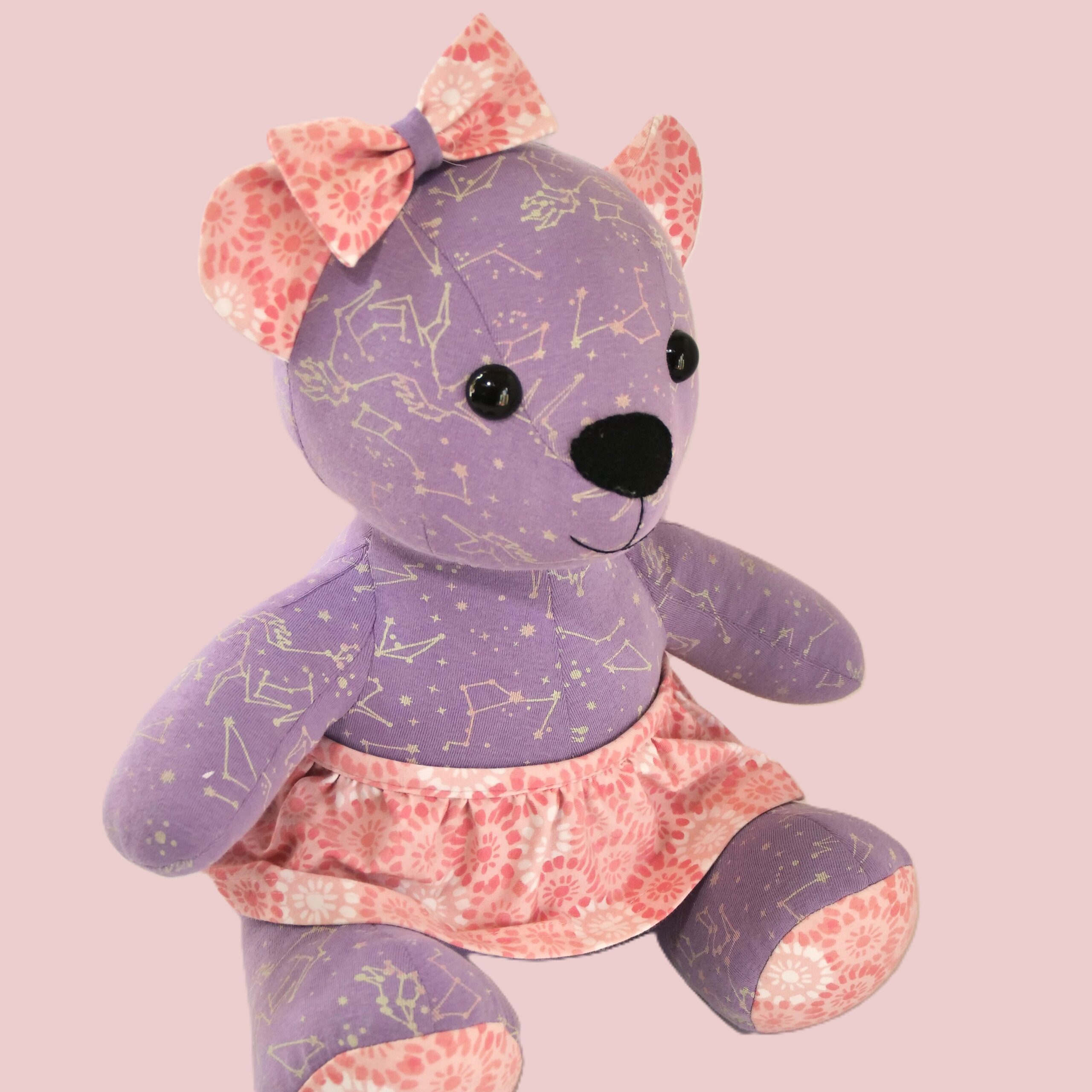 Handmade memory bear sewn from baby clothes — side view